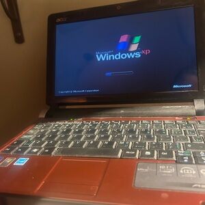 Acer Red and Black Laptop with Windows XP